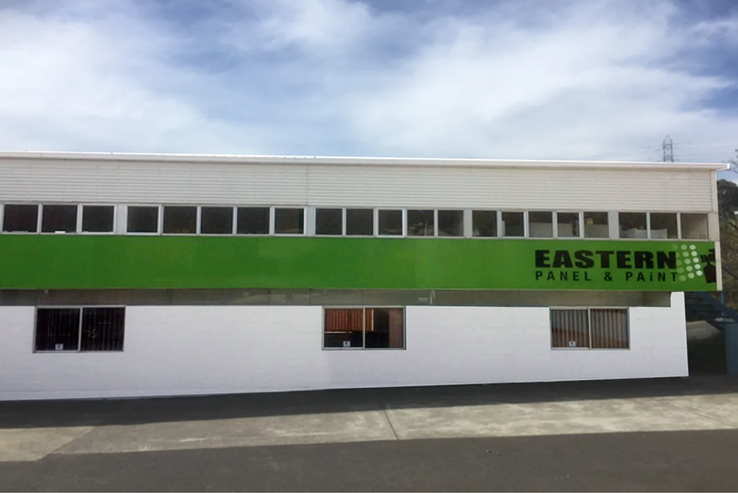 Eastern Panel & Paint workshop building exterior in Mornington, Tasmania, showing the green business signage