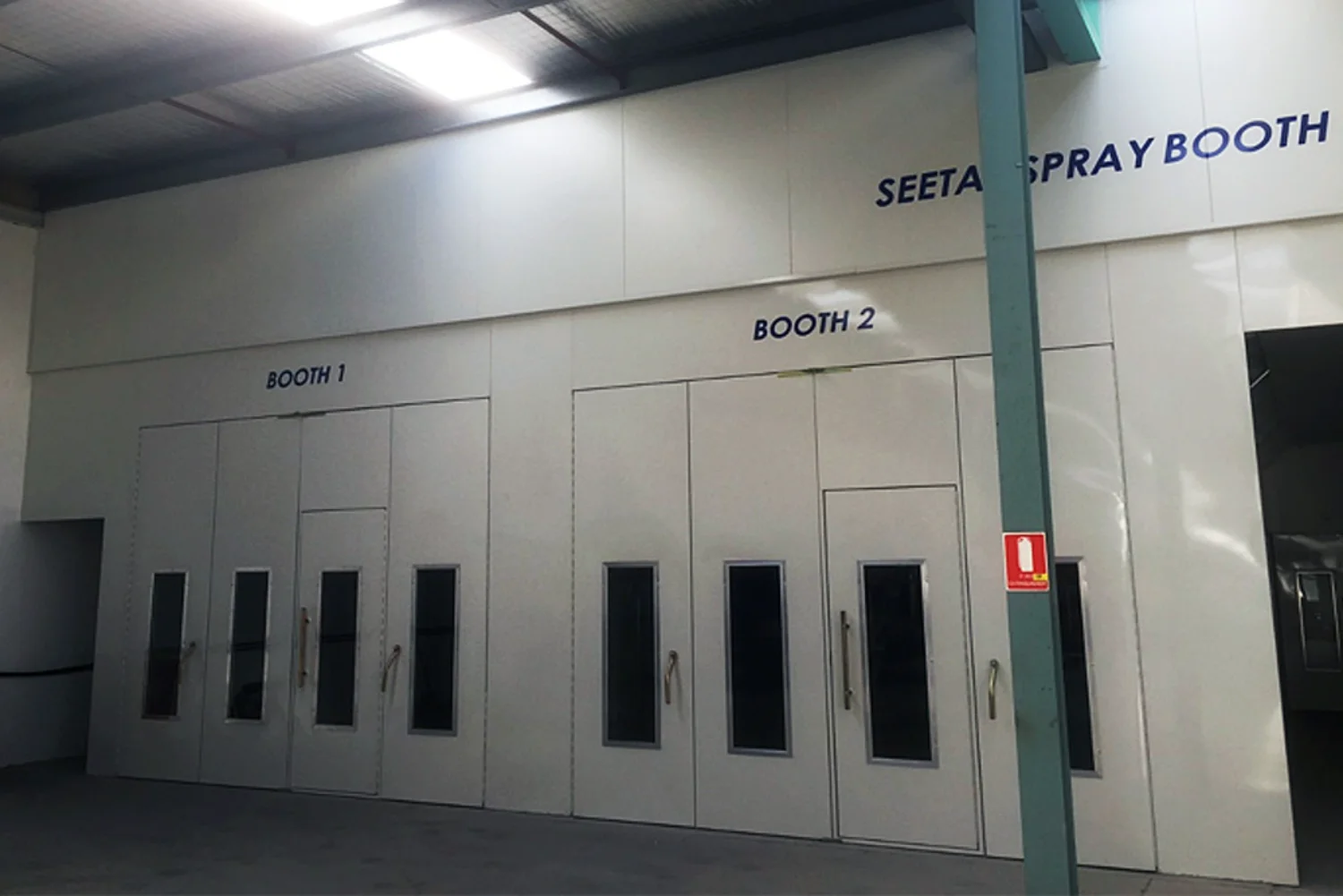 Seetal spray booths inside the Eastern Panel & Paint workshop — Booth 1 and Booth 2